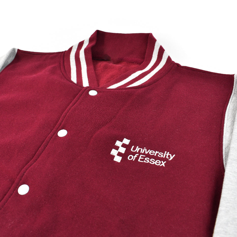 Burgundy Body/Heather Grey Sleeve Varsity Style Jacket with "University of Essex" printed on the left breast, close-up on logo